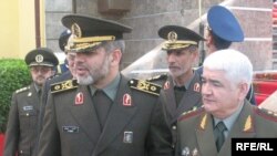 Sherali Khayrulloev, Tajikistan's minister of defense (right) and his Iranian counterpart, Ahmad Vahidi, in Dushanbe today