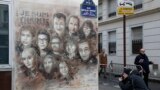 The artwork of French street artist Christian Guemy aka "C215" depicting members of satirical magazine Charlie Hebdo is painted on a facade near the magazine's offices at Rue Nicolas Appert, on January 7, 2020 in Paris,