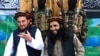 FILE: Tehreek-e Taliban Pakistan (TTP) spokesman Ehsanullah Ehsan (L) and with new TTP leader Adnan Rasheed in February 2013