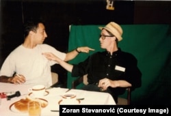 Zoran Stevanovic (left) and French journalist Paul Marchand sit in the Holiday Inn.