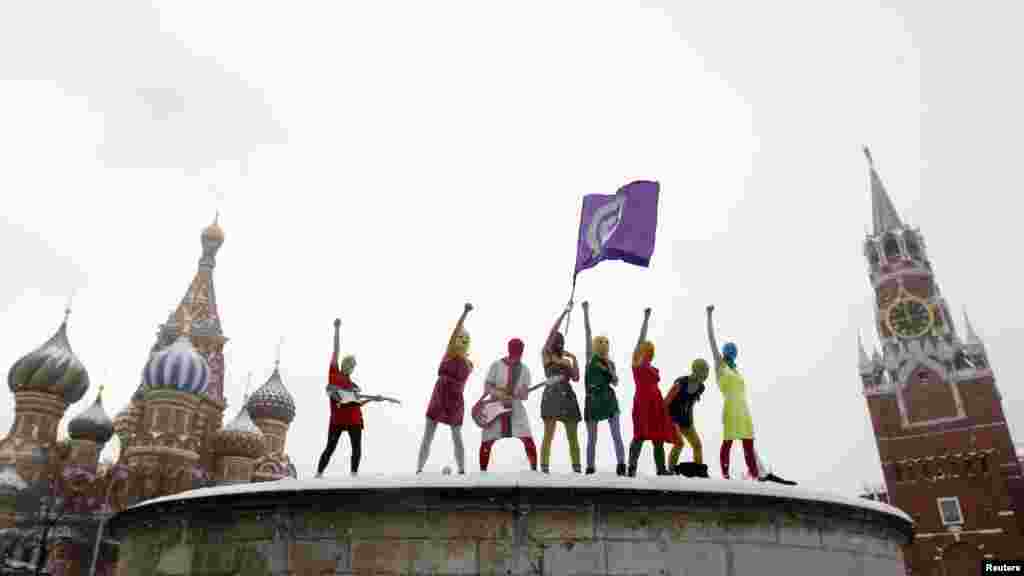 Members of the Russian radical feminist group Pussy Riot sing a song at Lobnoye Mesto, the site where Russian tsars once issued their decrees, on Red Square in Moscow on January 20. (Reuters/Denis Sinyakov)