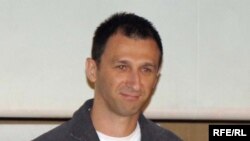 RFE/RL Reporter Milos Teodorovic receives an award for his film, "Heated Blood." (Belgrade, 04May2009)