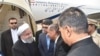 Telangana state Governor E.S.L. Narasimhan shakes hands wit Iranian President Hassan Rouhani (2L) upon his arrival at Begumpet airport in Hyderabad, February 15, 2018
