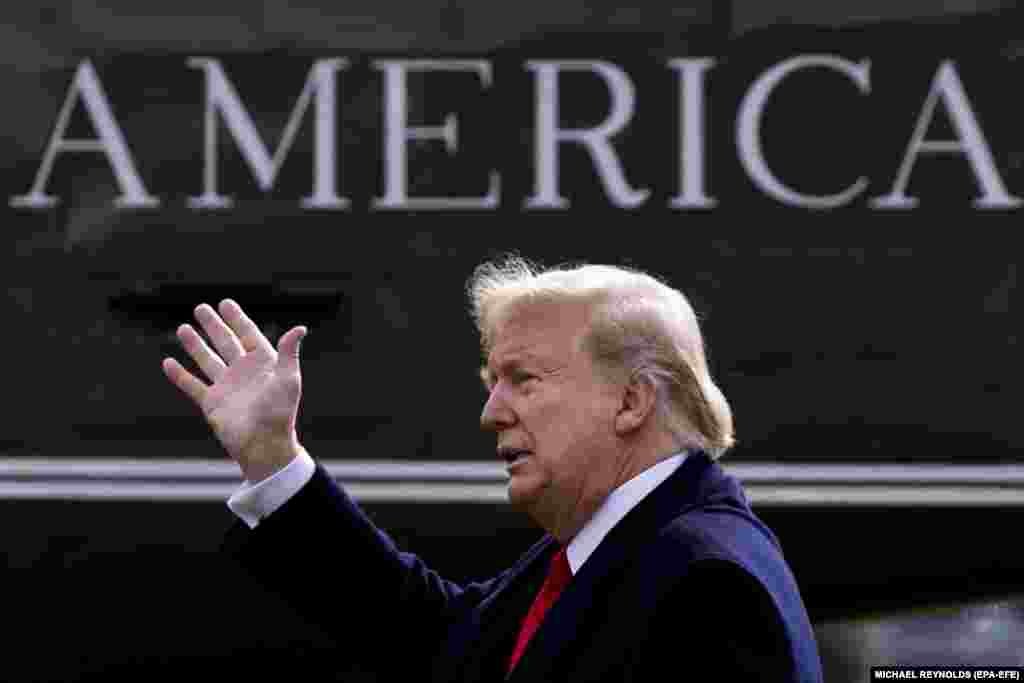 U.S. President Donald J. Trump waves to onlookers as he walks across the South Lawn of the White House to depart for Michigan by the Marine One helicopter on January 30. (epa-EFE/Michael Reynolds)