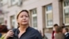 Russia -- Olga Romanova, the director of Rus Sidyashchaya (Russia Behind Bars), stands outside a Moscow court, August 18, 2014