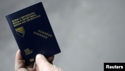 Bosnia-Herzegovina -- A man shows his new biometric passport outside a police station in central town of Zenica, 15Dec2010