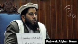 Fazal Hadi Muslimyar addresses senators after his election as Senate chairmanin March in Kabul.