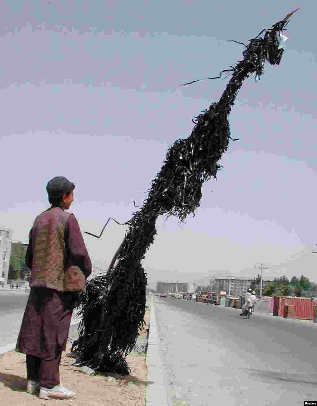 Music and movies were banned by the Taliban. This pole in Kabul is strung with tape stripped from destroyed cassettes.