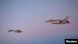 Russian Air Force fighter being escorted by a Norwegian Air Force jet on October 31, 2014.