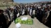 Relatives take part in a burial ceremony of one of the victims of the blast in Kabul on June 1.
