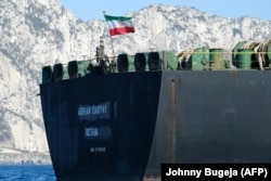 An Iranian flag flutters on board the Adrian Darya oil tanker off the coast of Gibraltar on August 18.