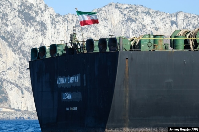 An Iranian flag flutters on board the Adrian Darya oil tanker off the coast of Gibraltar on August 18.