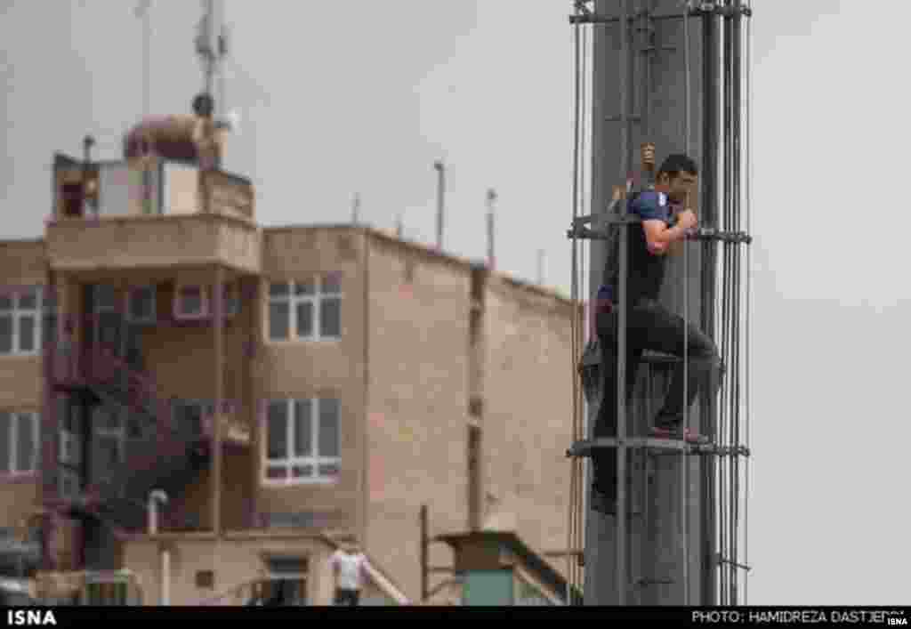 Emergency workers eventually persuaded the man to climb down to safety.