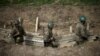 Nagorno-Karabakh -- Ethnic Armenian soldiers walk in a trench at an artillery positions near the town of Martuni, April 7, 2016