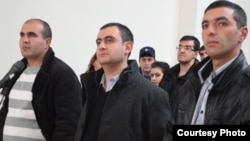 Armenia - Former soldiers Musa Serobian (L) Arayik Zalian (C) and Razmik Sargsian hear the announcement of a court verdict upholding their innocence in a high-profile murder case, Gyumri, 18Dec2012. (Photo courtesy of Asparez.am)