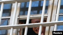 Yulia Tymoshenko is seen through a prison window in Kyiv earlier this month.