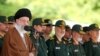 Iran's supreme leader Ayatollah Ali Khamenei (L) speaks during a visit to the Imam Hussein Military College in Tehran, May 20, 2015