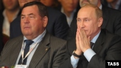 Duma deputy Vasily Shestakov (left) with President Vladimir Putin in 2013