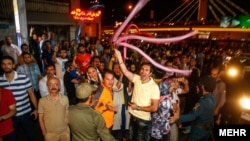 Iranians in Tehran celebrate the nuclear deal Iran made with six world powers on July 14.