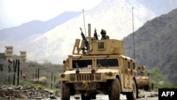 A U.S. Army humvee patrols in Nuristan Province in April 2009, after coalition forces pulled back from outlying bases there.