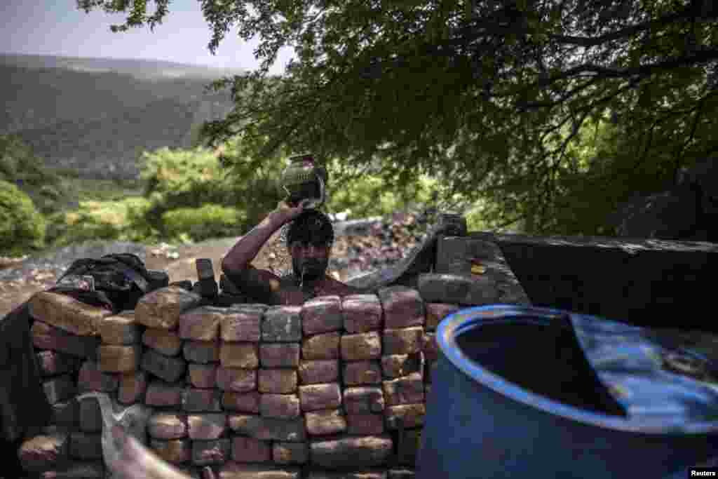 A miner washes after finishing his shift.