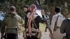 Fighters from the Balkans, including from Kosovo, appear in a propaganda video produced by the Islamic State extremist group in July 2015.