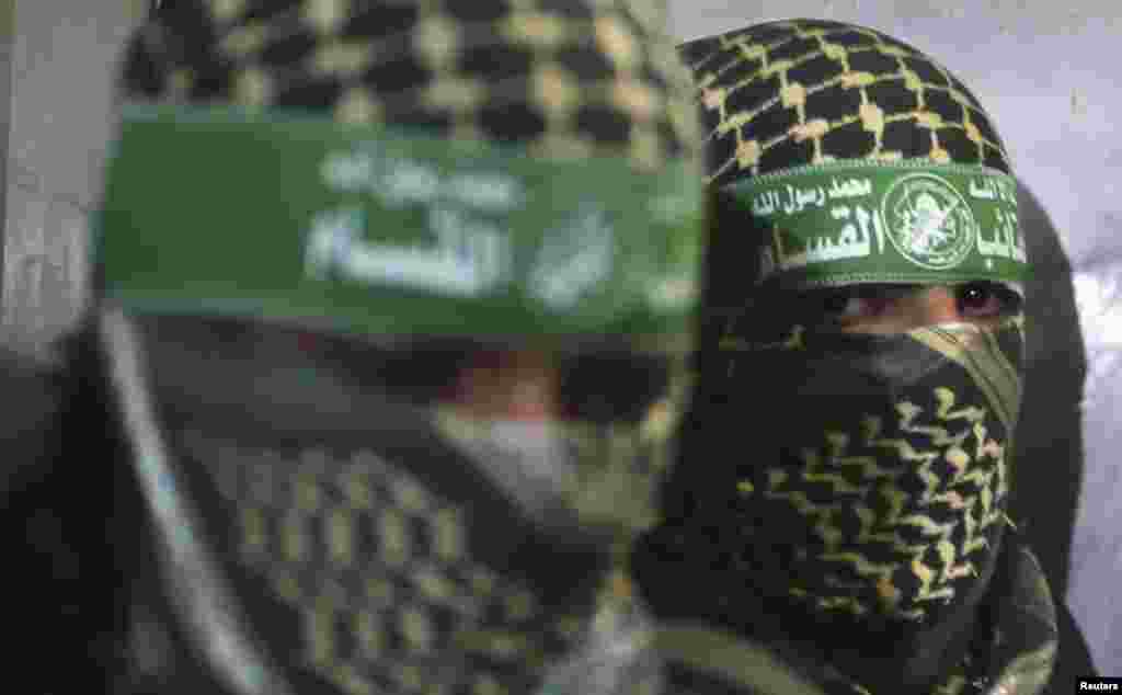 Members of Hamas's armed wing are seen inside a lift after attending a news conference in Gaza City. (Reuters/Mohammed Salem)