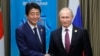 Putin, Abe Vow To Seek WWII Treaty, Solution To Island Dispute