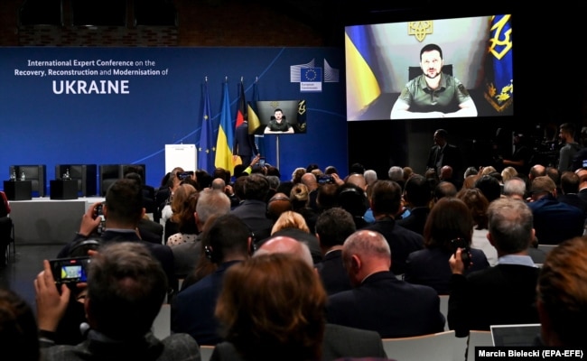 Ukrainian President Volodymyr Zelenskiy speaks to delegates via a video link during an international conference on Ukraine's reconstruction and recovery in Berlin in October. New Marshall Plan