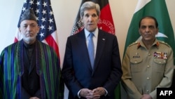 U.S. Secretary of State John Kerry (center) makes a statement before meeting with Afghan President Hamid Karzai (left) and the Pakistani Army chief, General Ashfaq Kayani, in Brussels on April 24.