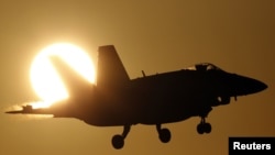 A Canadian CF-18A fighter prepares to land at the Birgi NATO Airbase in Trapani on the southern island of Sicily.