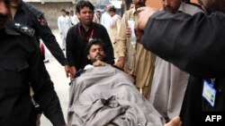 A previous victim of violence against polio-eradication workers is hospitalized in Mardan, Pakistan, in April. There have been more than 10 deaths so far at the hands of militants determined to block polio-vaccination campaigns.