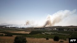Rrafshnalta Golan – Tymi vazhdon të del nga luftimet që u zhvilluan mes kryengritësve dhe forcave besnike ndaj regjimit sirian në pikën kufitare Kuneitra, 06Qershor2013