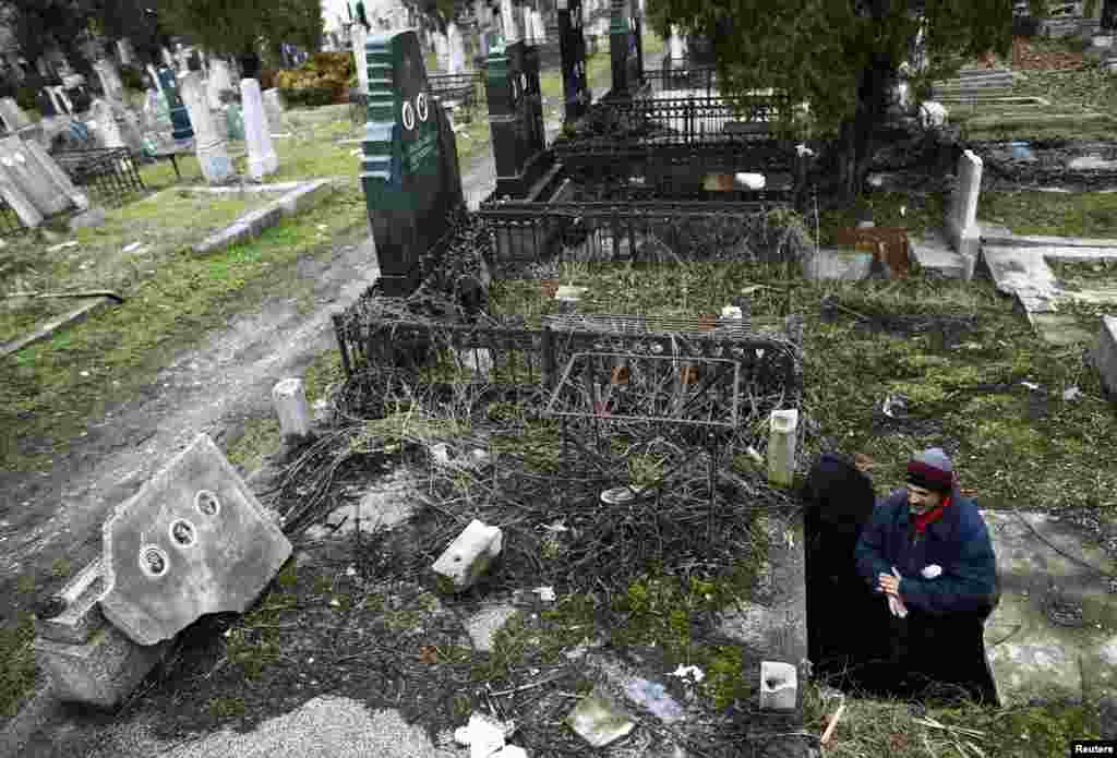 Serbia -- Bratislav Stojanovic, a homeless man, walks out of a tomb where he lives in southern Serbian town of Nis, 09Feb2013