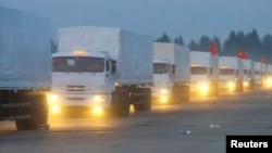 A screen capture of a Russian convoy of trucks that Moscow says is carrying humanitarian aid for Ukraine sets off from near the Russian capital on August 12.