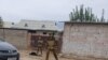 Police investigators work at the site of an attack at the Ishkobod border post in Rudaki district on November 6.