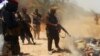 An image uploaded on June 14 to a jihadist website allegedly shows ISIL militants executing dozens of captured Iraqi security personnel.