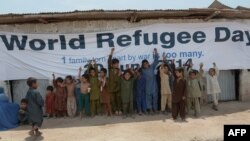 Afghan refugee children gather at a special medical camp set up by the UNHCR with the coordination of the Pakistani Medical Dental Association to mark World Refugee Day in Islamabad on June 20. 