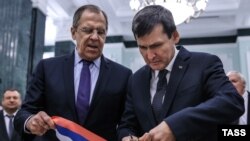 Russian Foreign Minister Sergei Lavrov (left) and Turkmen Foreign Minister Rasit Meredow cut a ribbon during the opening ceremony for new Russian Embassy buildings in Ashgabat on January 27. Lavrov just happened to be in town at the same time as a high-level meeting of Caspian Sea states. 