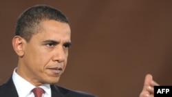 U.S. President Barack Obama takes a question during his first prime-time press conference in the East Room of the White House.