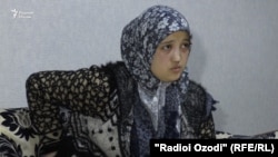 Nilufar Rajabova says that one of the arresting officers threatened to rape her. 