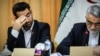 Iranian ICT minister Mohammadjavad Azari Jahromi (L) and A senior member of parliament Alaedin Boruoujerdi, April 09, 2018.