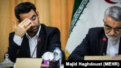 Iranian ICT minister Mohammadjavad Azari Jahromi (L) and A senior member of parliament Alaedin Boruoujerdi, April 09, 2018.