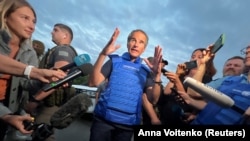 IAEA Director-General Rafael Grossi speaks with journalists after he and a part of the IAEA mission came back from the Zaporizhzhya nuclear power plant at a nearby Ukrainian checkpoint on September 1.