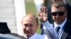 FINLAND - Russian President Vladimir Putin waves upon his arrival at the Helsinki-Vantaa Airport in Helsinki, on July 16, 2018 prior to a summit between him and the US President