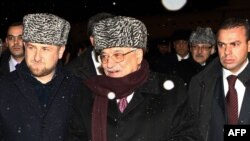 Palestinian leader Mahmud Abbas (center) is greeted by Chechen President Ramzan Kadyrov (left) upon arrival in Grozny.