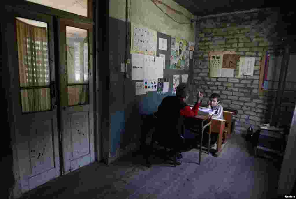 Bacho attends a lesson at Makarta primary school.