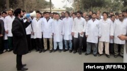 Herat doctors demonstrate against the alleged beating of a pediatrician by the city's mayor and the mayor's son.