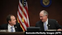 U.S. House Intelligence Committee ranking Democrat Representative Adam Schiff (left) and Representative Mike Conaway (right), who is heading the committee's investigation into alleged Russian meddling in the 2016 presidential election.