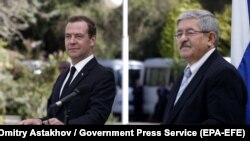 Russian Prime Minister Dmitry Medvedev (left) and Algerian Prime Minister Ahmed Ouyahia following their talks in Algiers on October 10